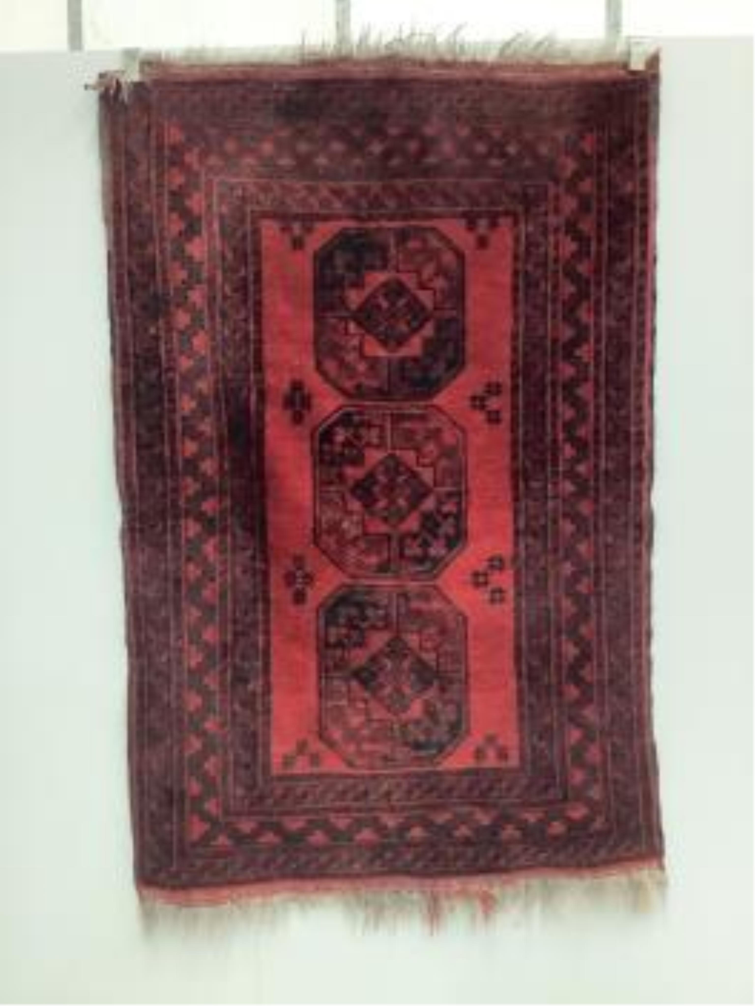 Two Afghan red ground rugs, largest 170 x 120cm. Condition - fair